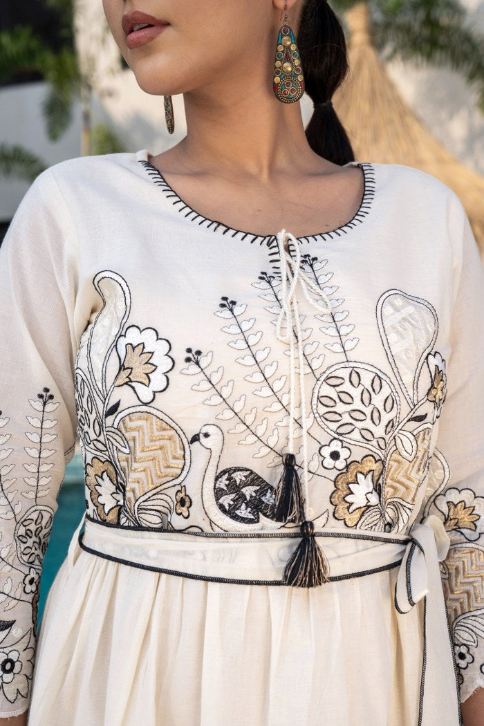 Desert Bloom: Off-White Embroidered Cotton Dress with Elegant Flair