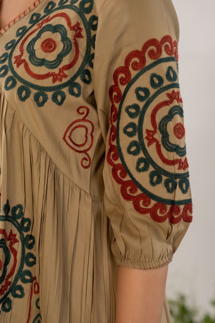 Bohemian Elegance: Beige Dress with Artistic Circular Flair