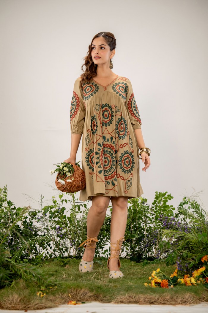 Bohemian Elegance: Beige Dress with Artistic Circular Flair