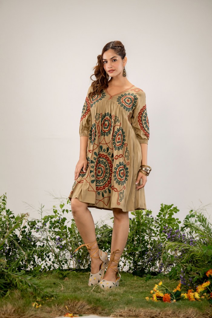 Bohemian Elegance: Beige Dress with Artistic Circular Flair