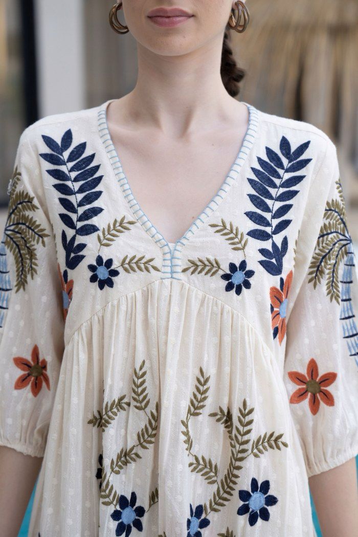 Summer Bloom: Vibrantly Embroidered Off White Dress