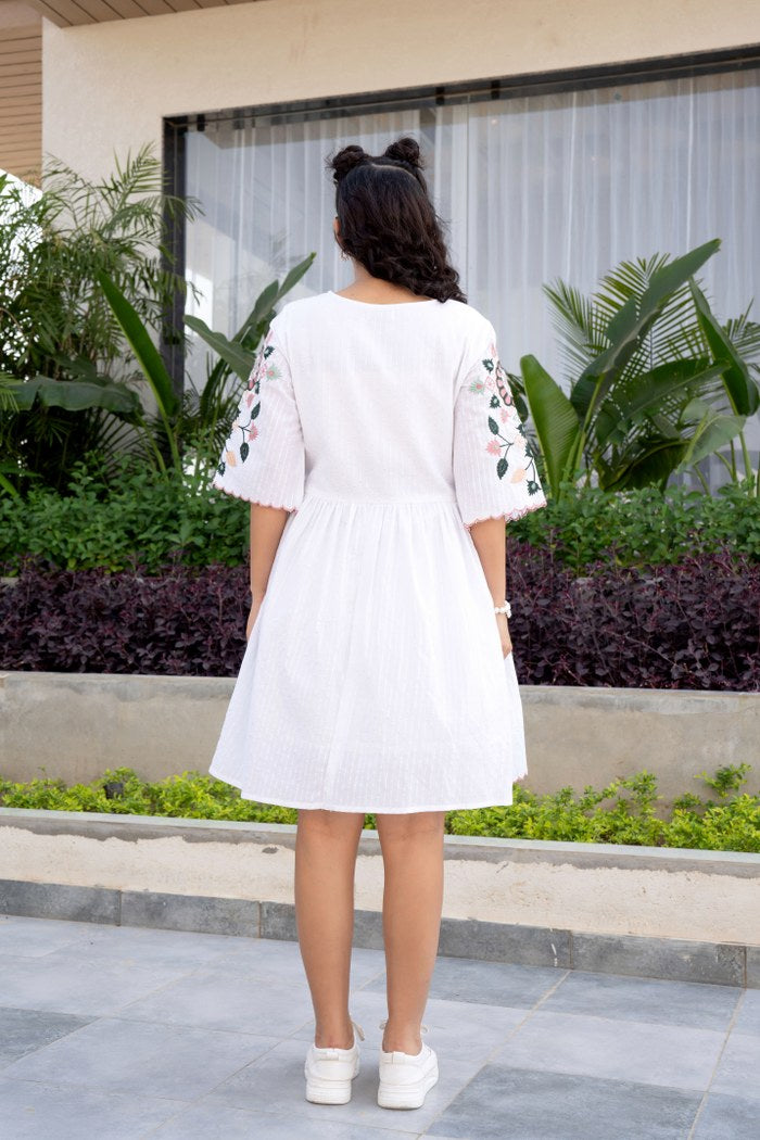 Blossom Grace: White Summer Dress with Vibrant Embroidery